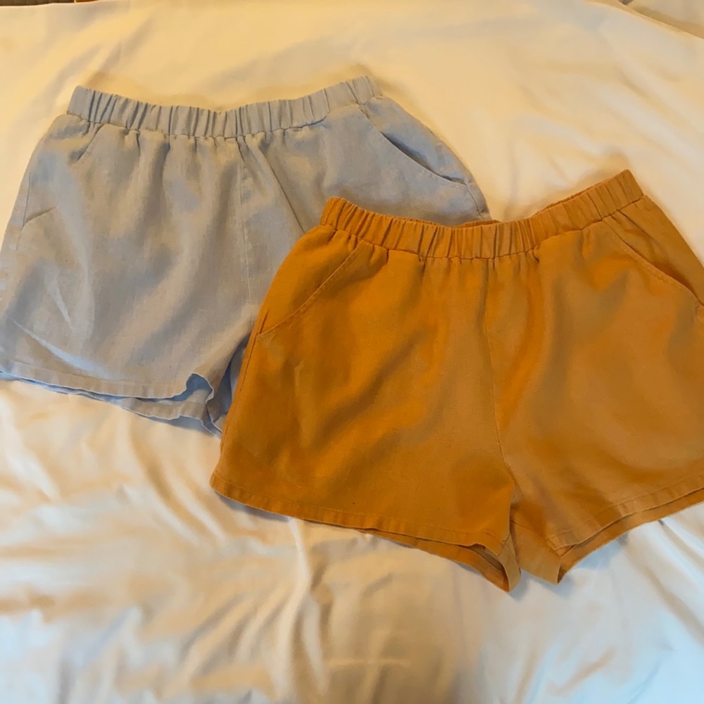 TWO shorts, light blue and mustard yellow